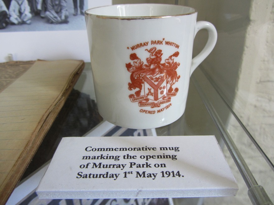 A mug on display in Twickenham Museum. Each local child was given a mug to celebrate the park being bought for the community, but the community.
