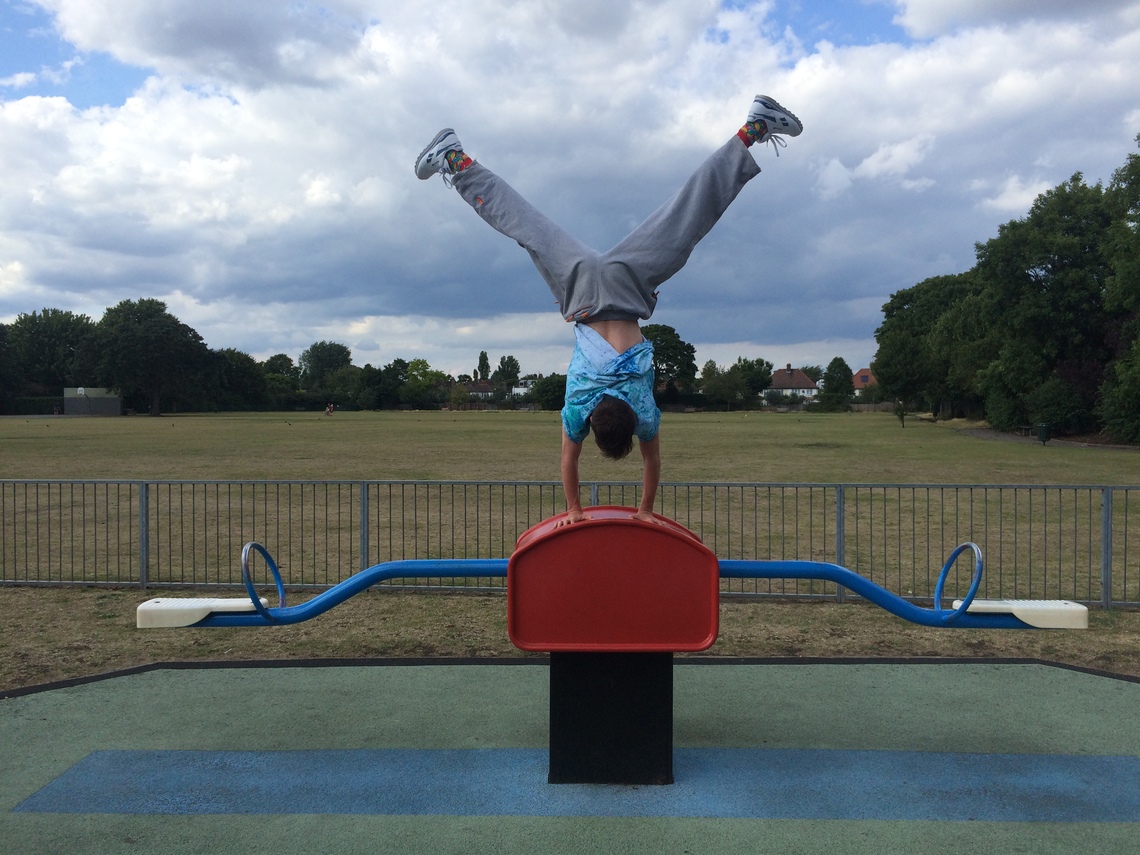 Handstand in playground by local kid
