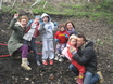 Families planting wildflower plugs