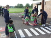 Greenacres children show how to cross the new play road