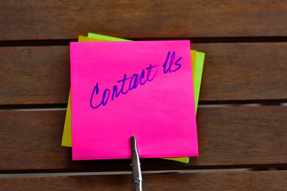Postit notes with Contact us on them