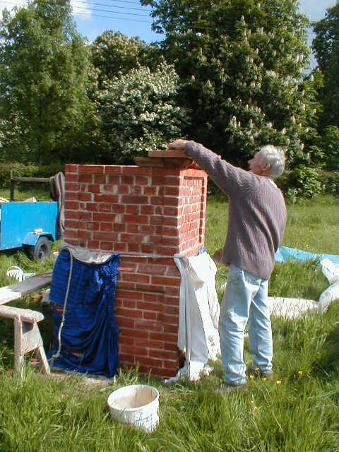 Peter Rowe building the sign