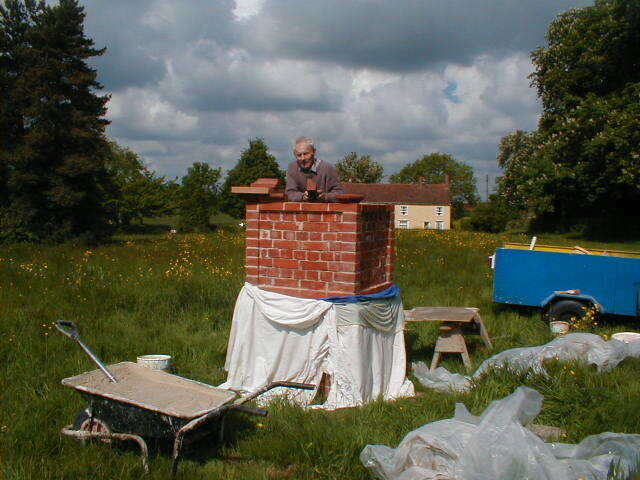 Peter Rowe building the sign