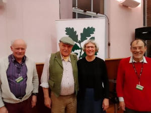 Four people standing in front of a National Trust pull-up banner