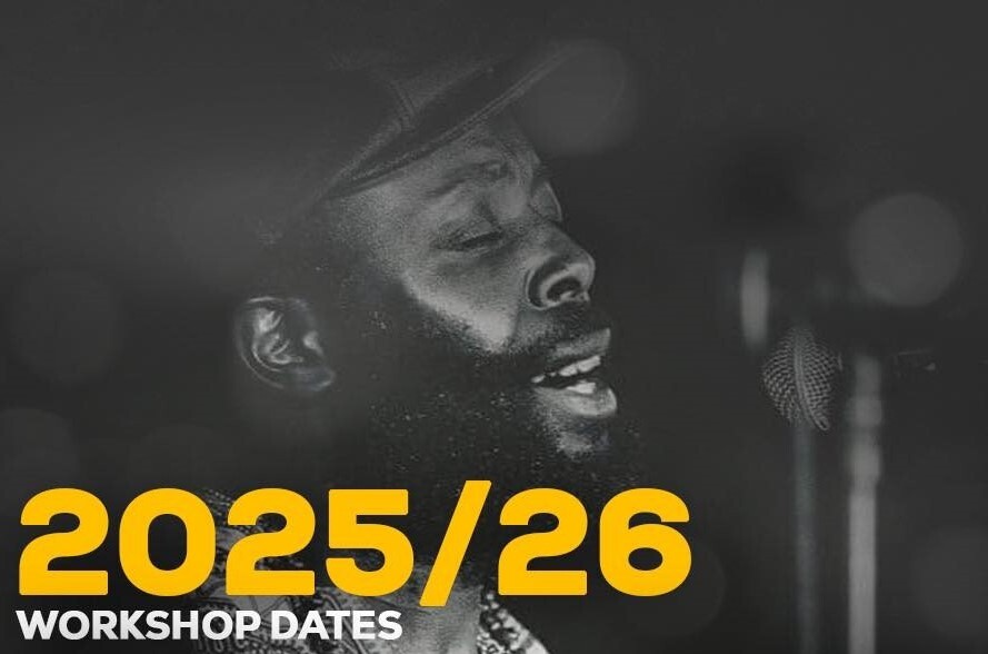 A black Male singer (Bruce Ncube) side on headshot, singing. 