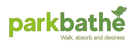 green writing on white backgrund and small trees