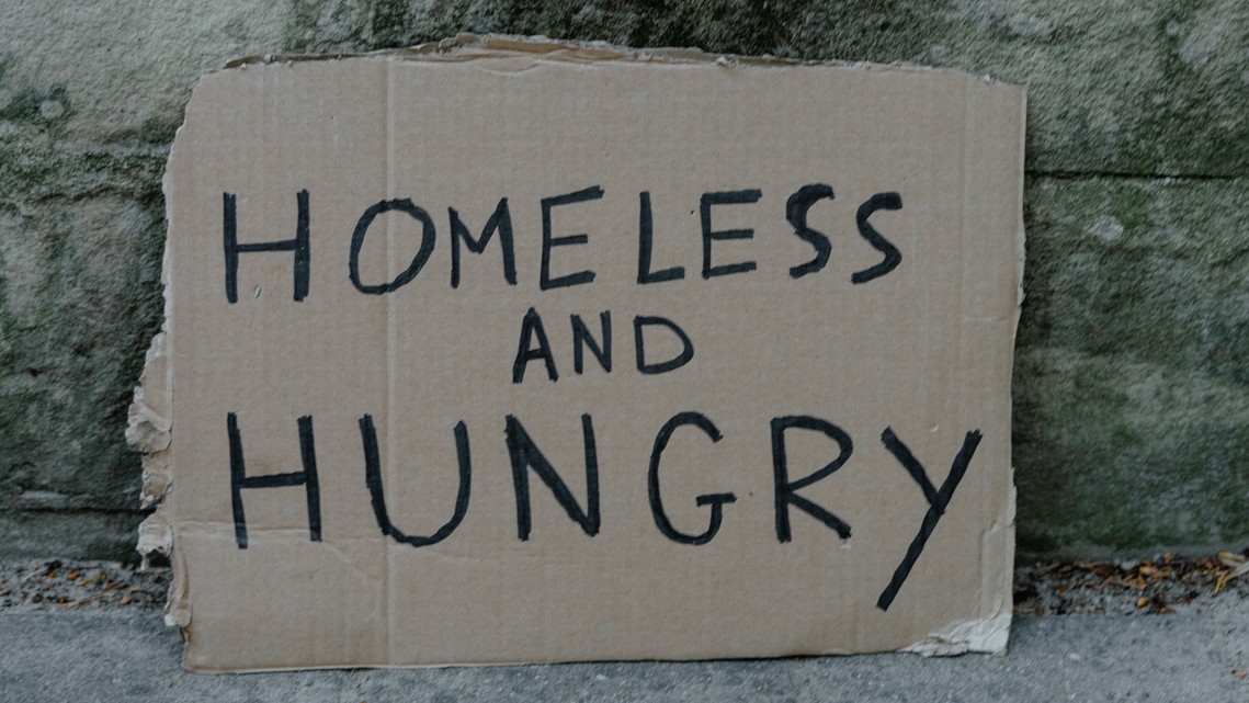 Photo of the words Homeless written on a piece of cardboard