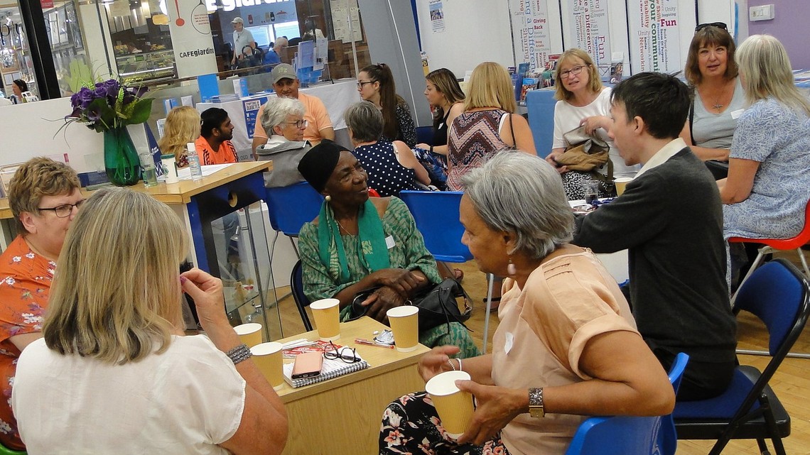 Photo of a group of people meeting together at the Volunteer Centre