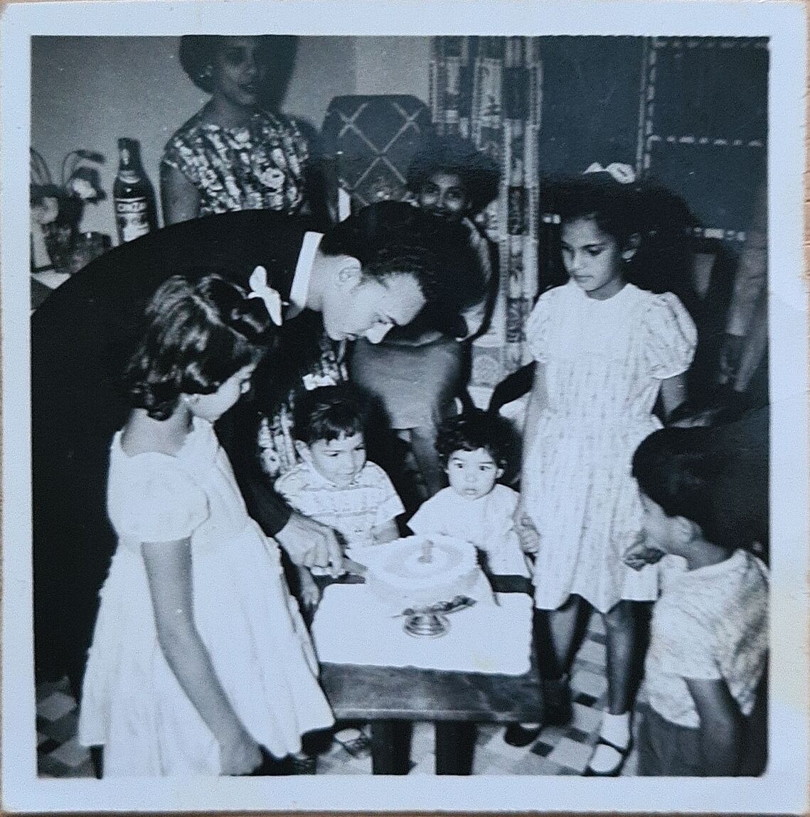 Lilian's 1st Birthday May 1959:  L to R, Yvonne, Fanchu cutting the cake, Lorraine Lilian holding Jennifer's hand, and Claude