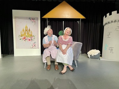 Simon on the left is playing one of Cinderella's evil step-sisters whilst Gemma on the right is playing Cinderella. 