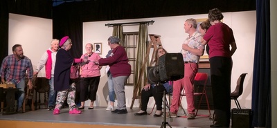 Most of the cast onstage, with Jacky (wearing the pink crocs) acting as the writer of the play inside the play