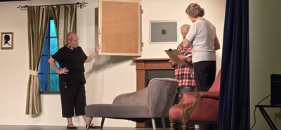 The safe behind the picture on the set