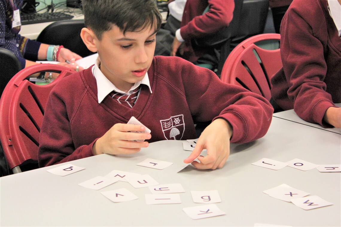 Child Sorting Letter Cards