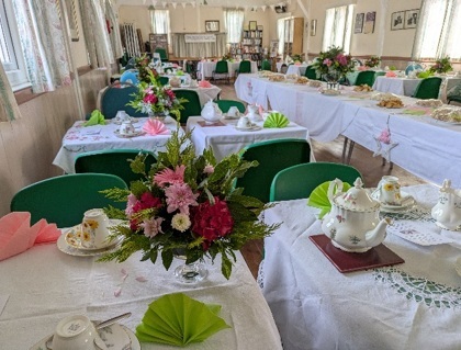 Picture of village hall interior decorated and tables laid for vintage tea