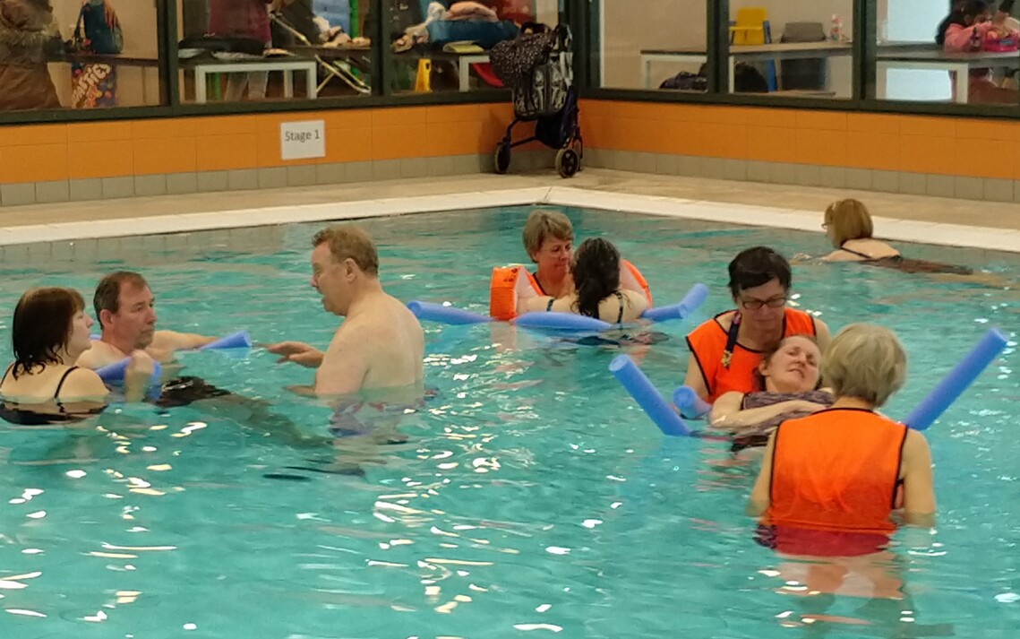 Photo of Volunteers and Members exercising and socialising