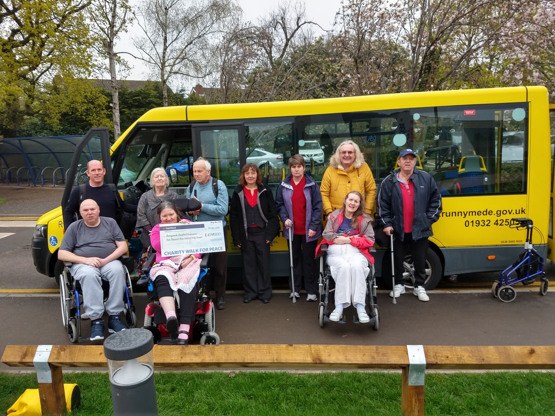 Photo of Members beside transport bus