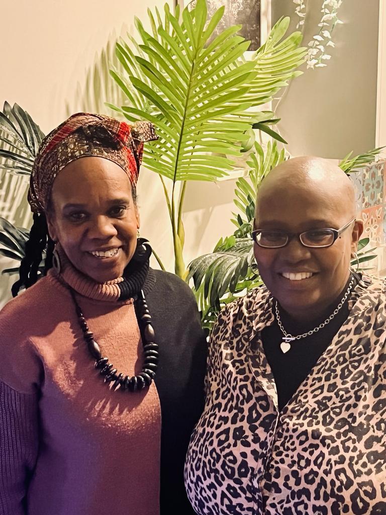 The two co-directors of FIH standing together smiling