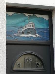 Queen Street showing one of many Staine Glass front doors