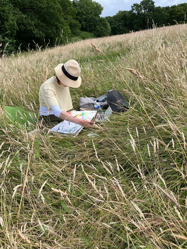 Artist in the wildflower meadow