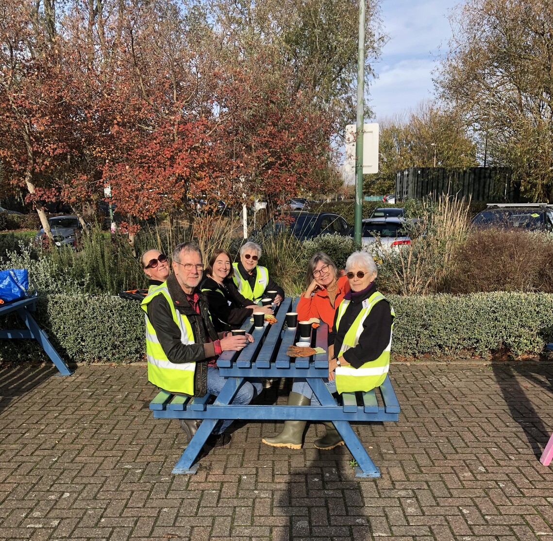Friends having a cup of tea after litter pick