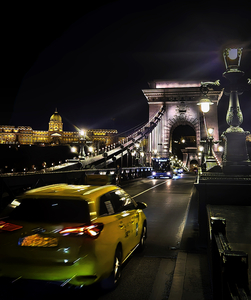 Taxi Over Chain Bridge