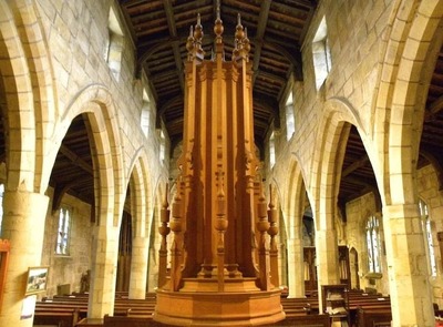 The font cover at St Nicholas' Church, Bradfield, was designed by George Pace, and carved by CH Gillam & Sons of Sheffield in 1959.