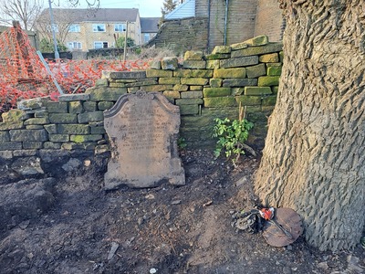 We have dug out this gravestone that was buried under the collapsed wall and thankfully not damaged