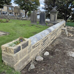 the left-hand wall is finished, with an end-wall column incorporating a space for planting 