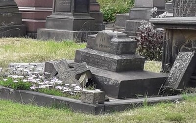 Vint grave and cross in need of repair