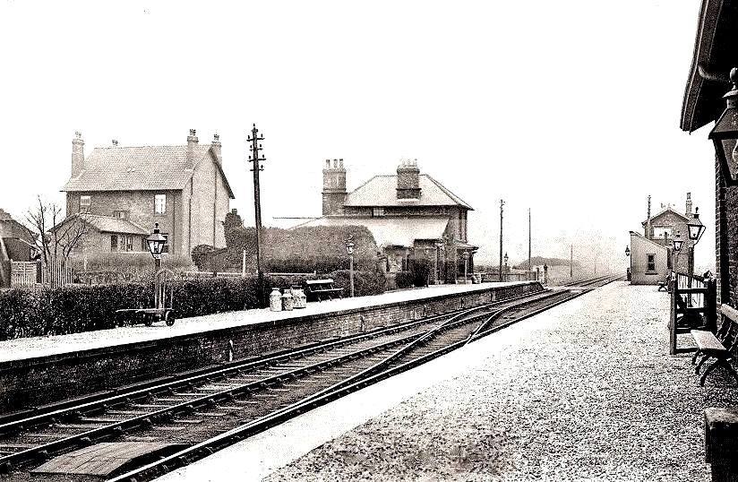 1930's? photograph of Hunmanby Railway Station, gas lights and milk churns