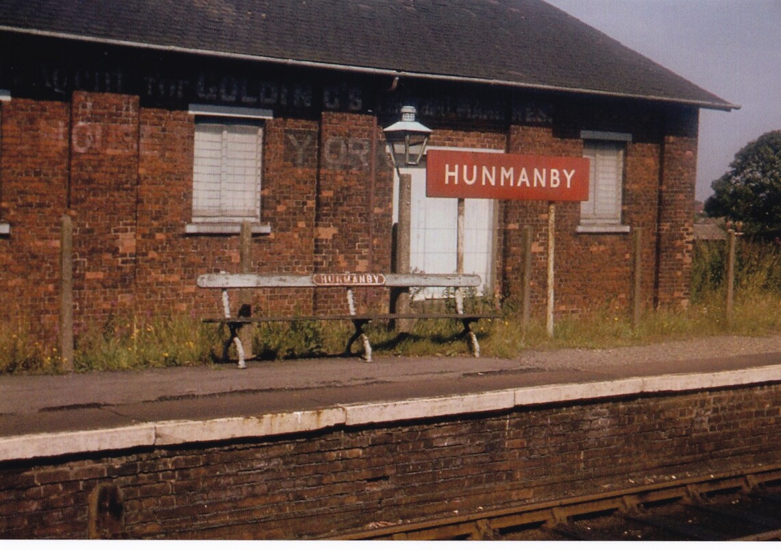The Down platform at Hunmanby in 1969 with seat, name board and gas lamp
