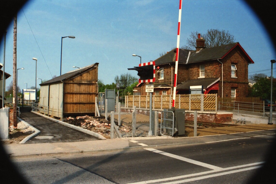 2001 New half barrier installed at Hunmanby Railway Station wooden waiting shelter rains for a few more days