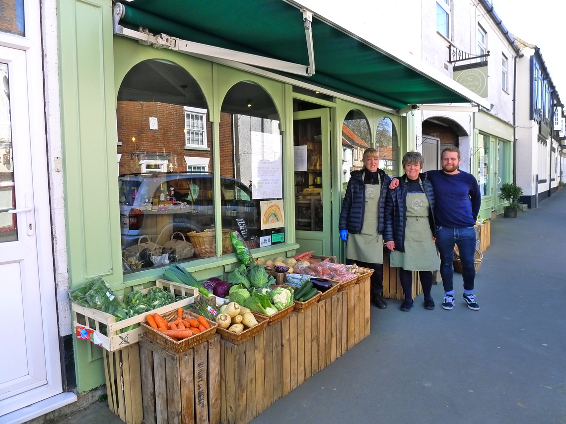 Hunmanby Deli and Green Grocers staff together outside the two shops on Bridlington Street
