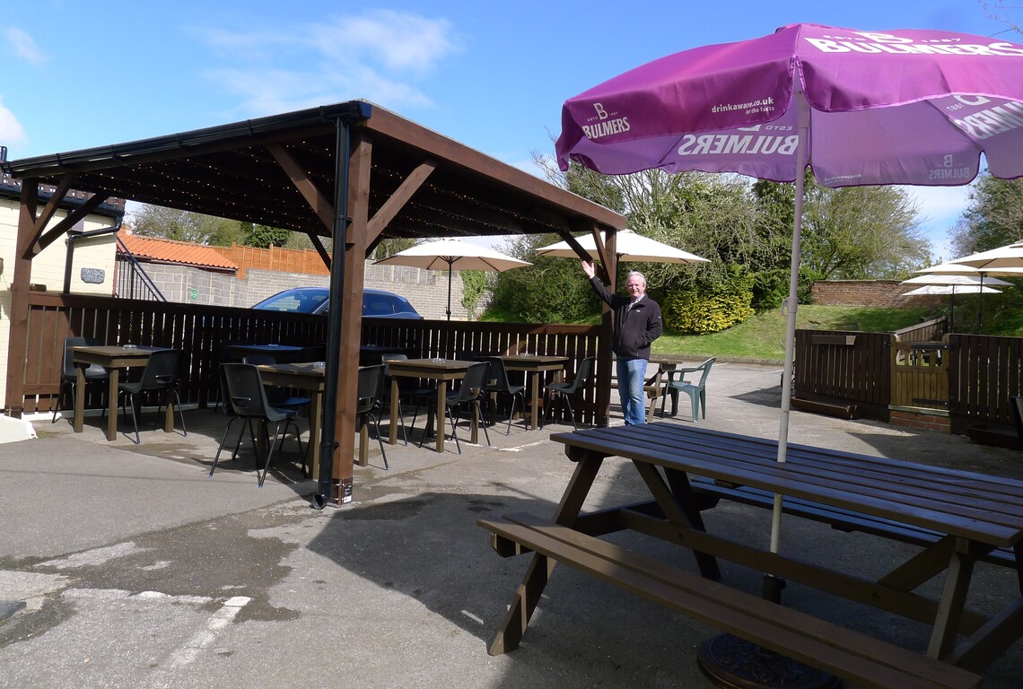 Landlord Dave, Horseshoe Public House, Hunmanby, with the new outdoor seating area, shelter and brollies for April 2021