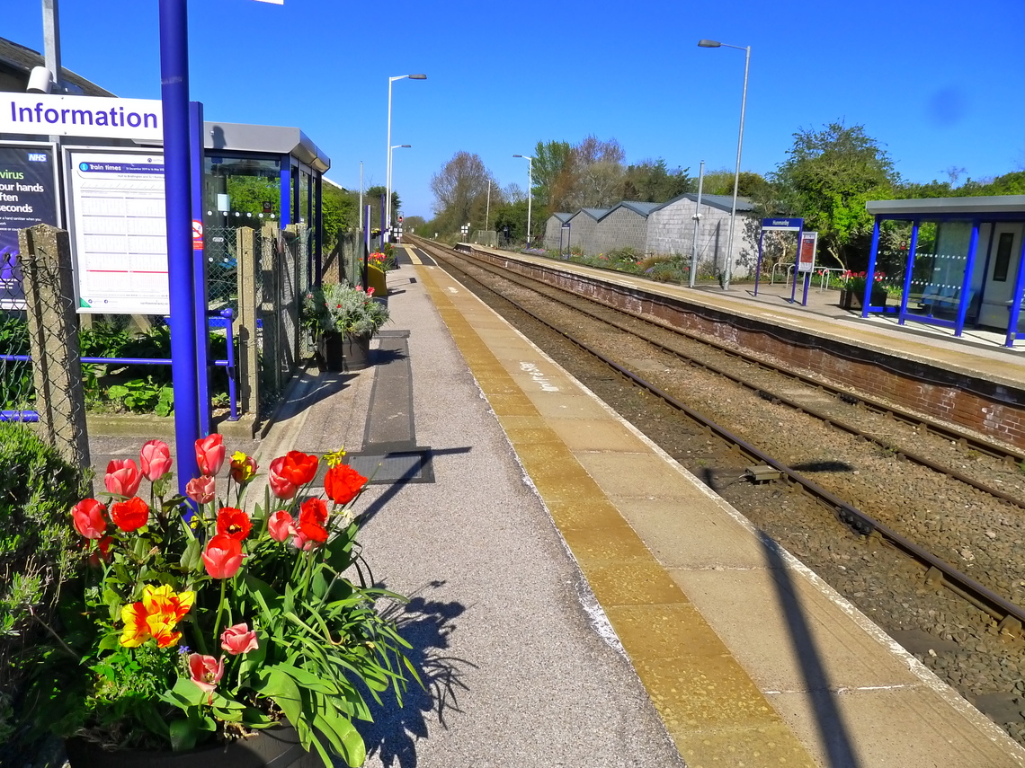 Down, Scarborough Platform showing new waiting shelters and flower in April 2020