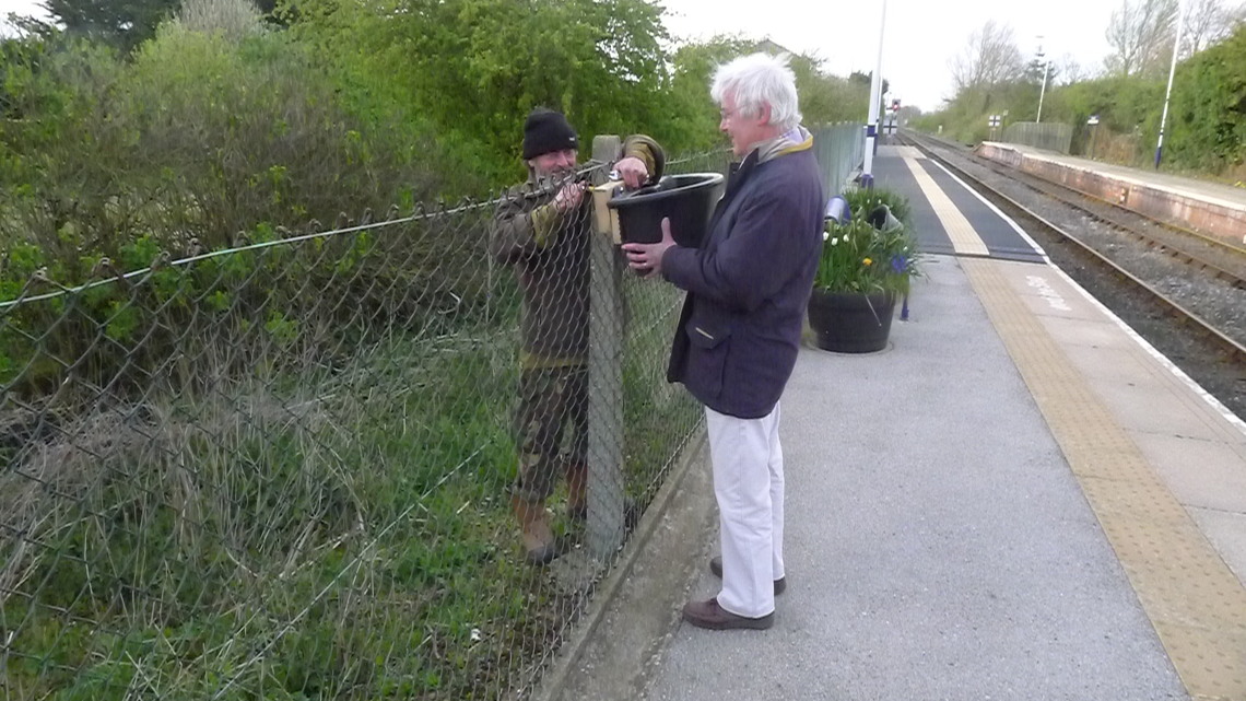 Geoff and John put up the planters on the Scarborough platform at Hunmanby Railway Station