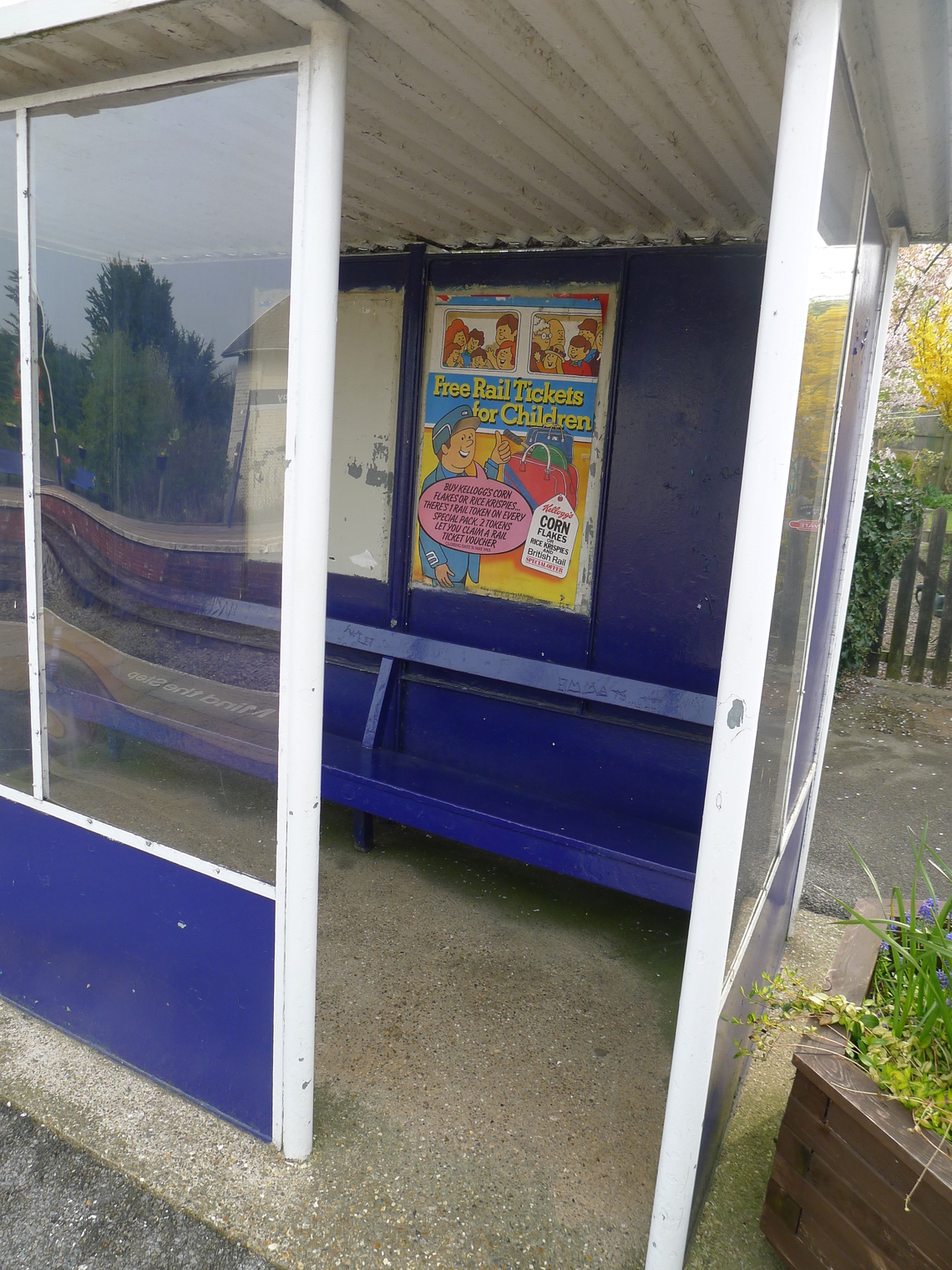 Old Waiting Shelter on Platform 1 at Hunmanby showing heritage bench and poster