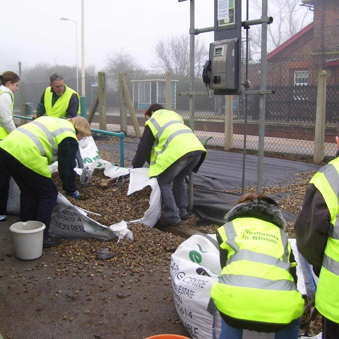 Emptying bags of gravel for the new beach bed, Hunmanby Railway Station