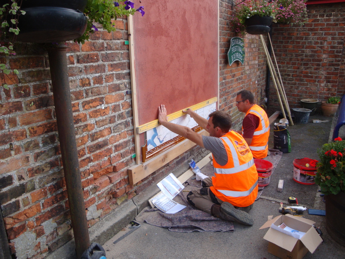 Tile Map, John and Chris start putting the first North Eastern Railway Tiles at Hunmanby Station, 10th August 2021