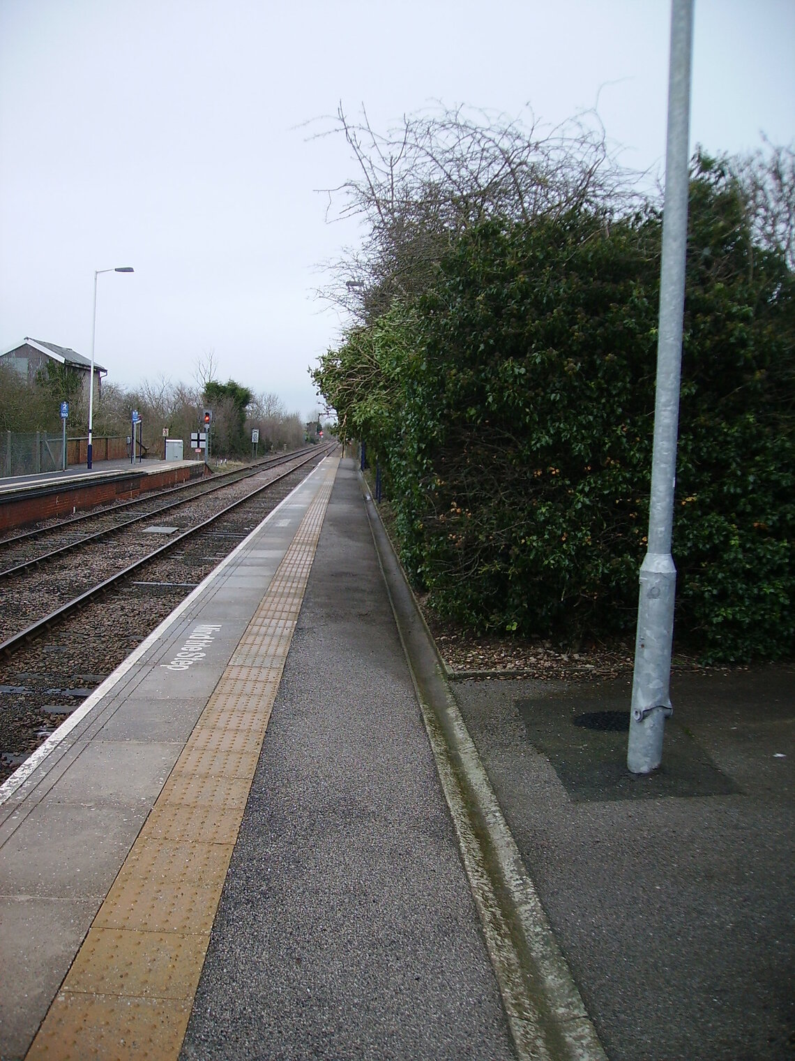 Platform 1 at Hunmanby towards Scarborough prior to starting work on the over grown hedge