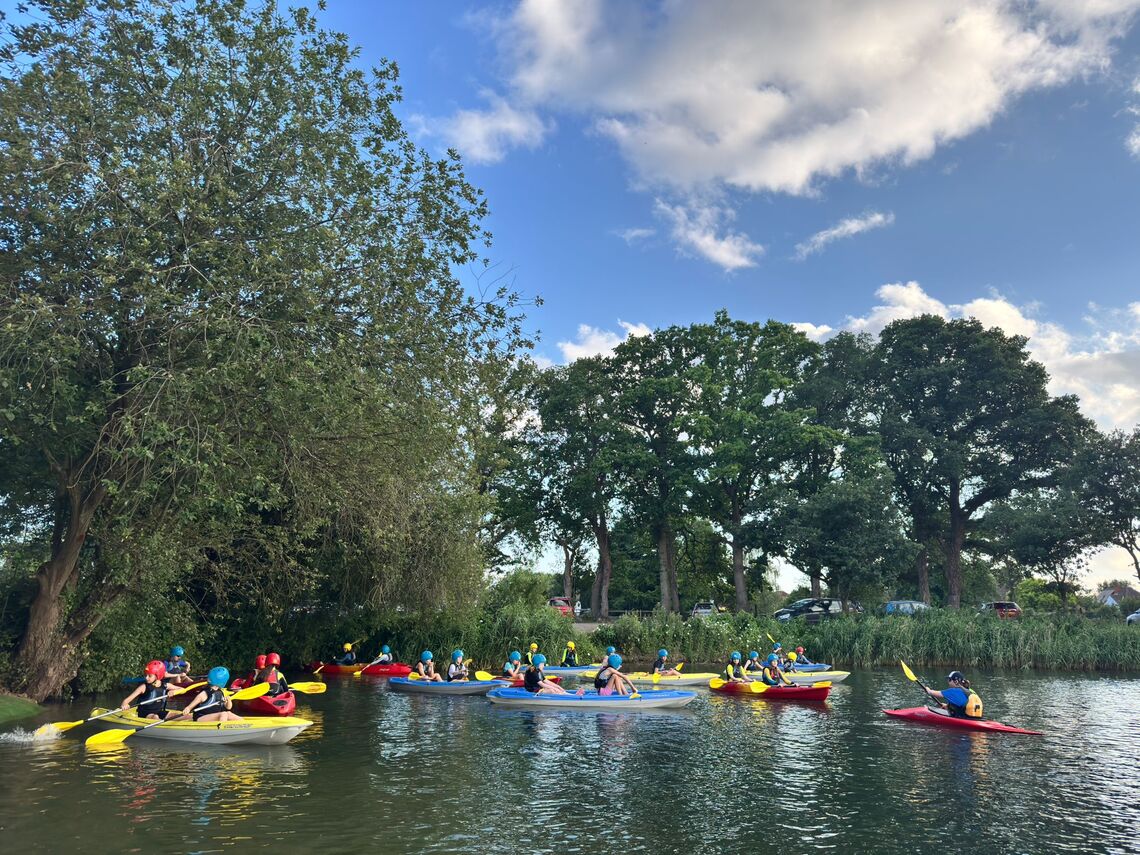 Guides kayaking on a lake