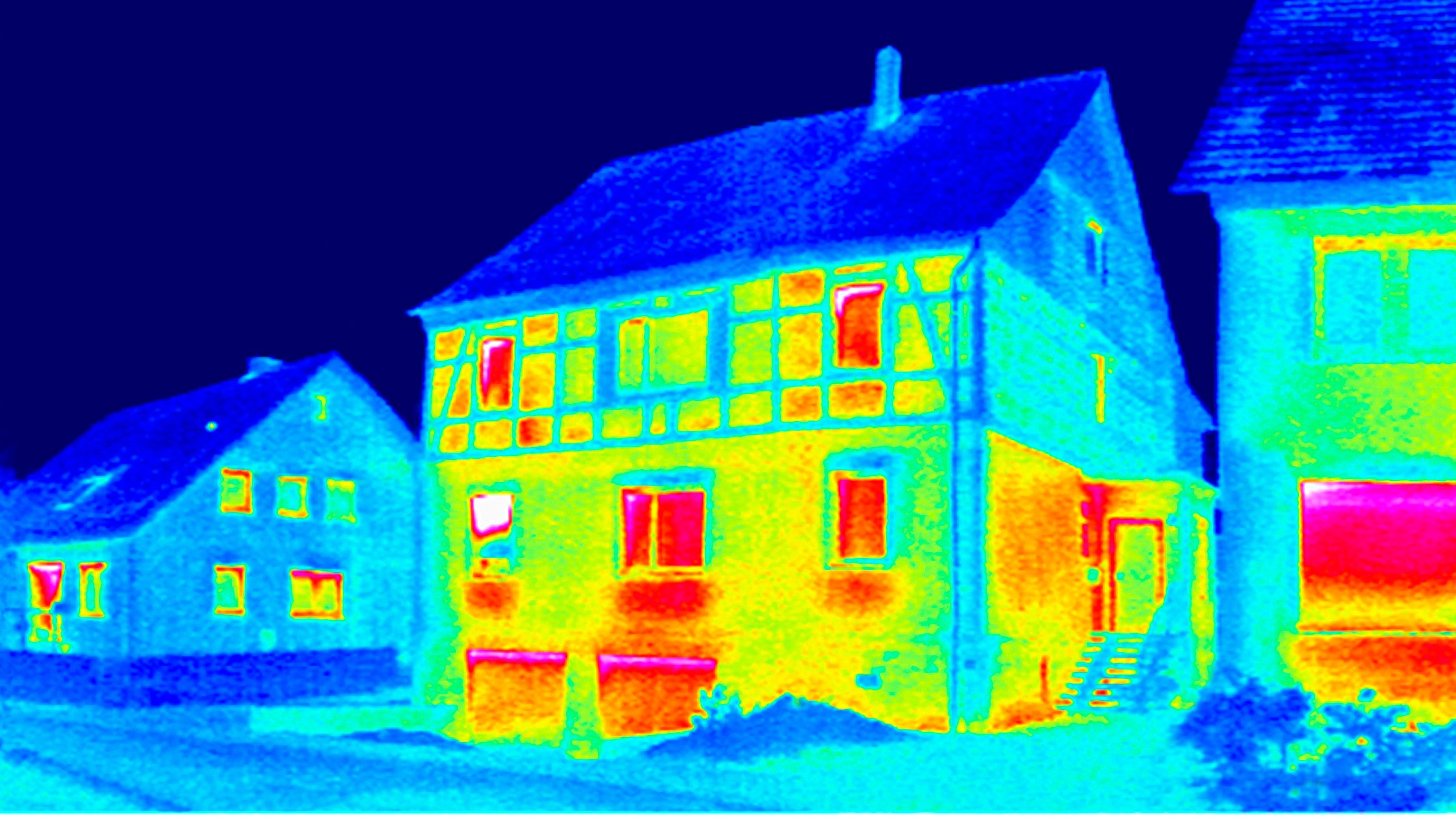 Thermal image of a house showing heat escaping