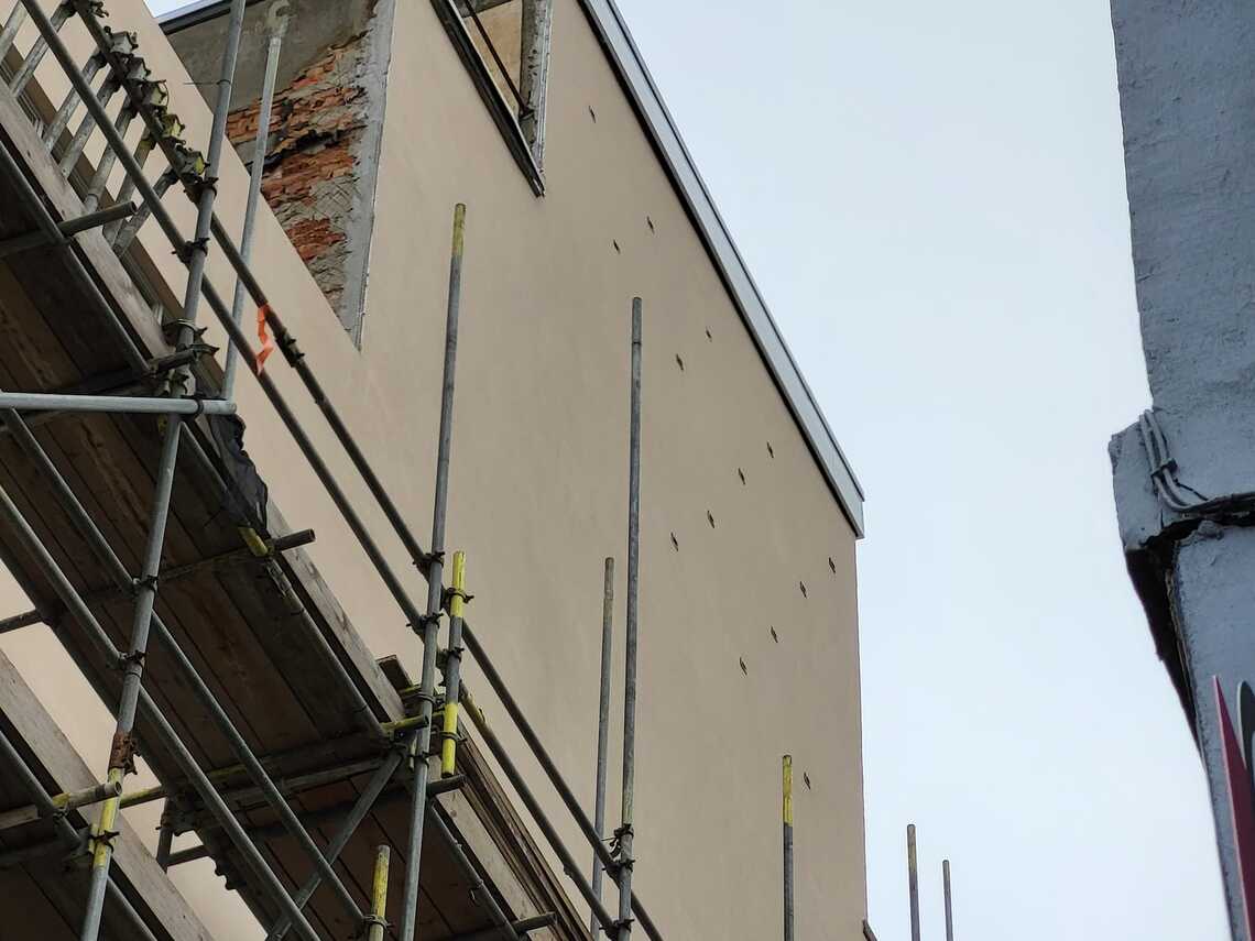 photo of top of lift tower with entrance holes to 14 swift bricks visible