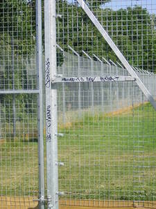 Graffiti on the fence after just a few days