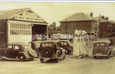 332A - Stone Bridge - Bonds Garage with a selection of cars - 1950
