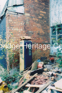 837A - Co-op building - Buildings at the rear off Barclay Roa showing petrol pump. - 2002-2005