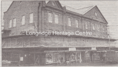 861A - Co-op building - Newspaper clipping front of main building with scaffolding - Unknown