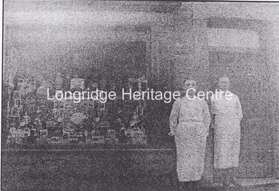 893 - Co-op building - Group of employees outside main building - Unknown