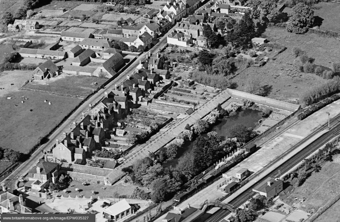 The Floral Retreat, with its ornamental lake, in 1931. The railway station is bottom right. © Britain from Above