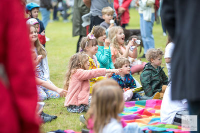 Children and parents enjoying Punch and Judy